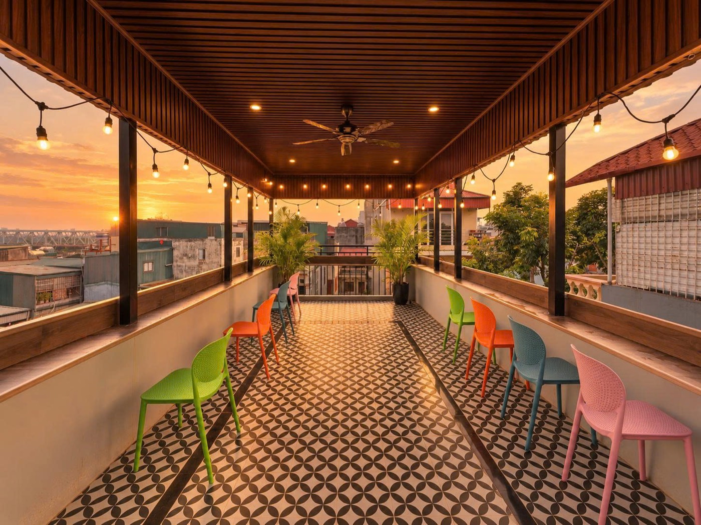 The terrace at sunset under string lights